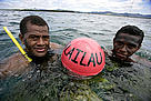 Naduri village youths with the buoy that marks the boundary of the new marine protected area.